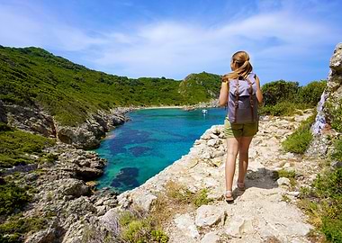 Woman Hiking Coastal Trail with Backpack in Corfu, Greece