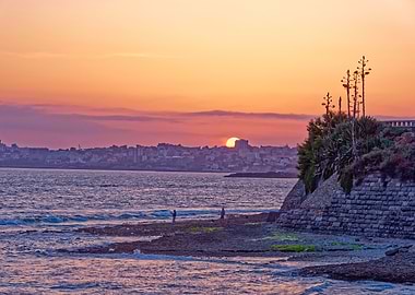 Coastal Sunset with Cityscape