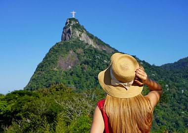 Woman with hat looking at Christ the Redeemer, Rio de Janeiro, Brazil