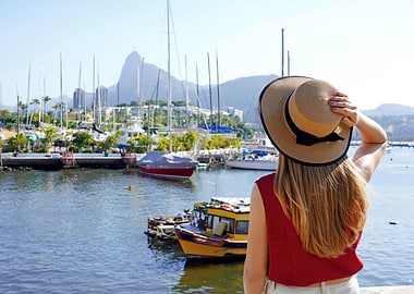 Woman with hat overlooking Rio de Janeiro harbor, Brazil