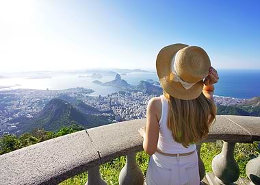 Woman with hat overlooking on Corcovado in Rio de Janeiro, Brazil