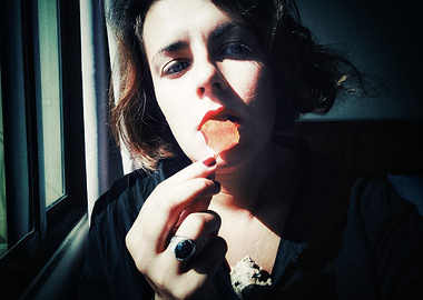 Woman with Leaf in Mouth