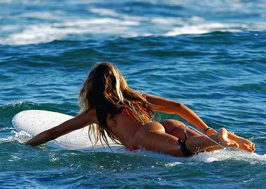 Surfer Girl Paddling Out