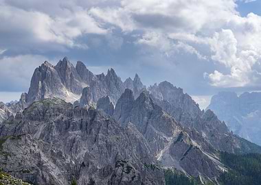 Majestic Mountain Range Under Cloudy Sky