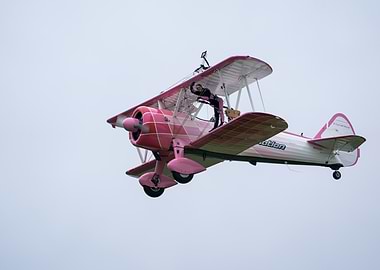 Pink Biplane with Wing Walker