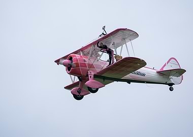 Pink Biplane with Wing Walker