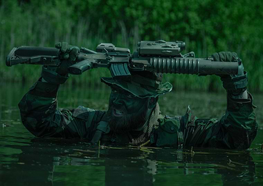 Soldier in Water Holding Rifle