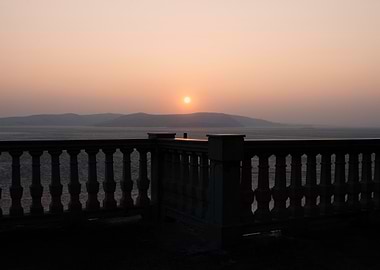 Sunset over the sea from balcony