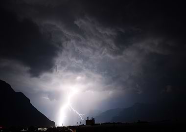 Dramatic Lightning Strike Over Mountain Town