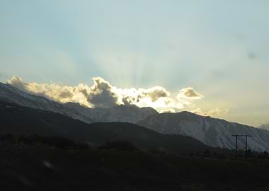 Mountain Range with Sunlight and Clouds