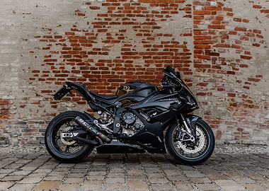Black Motorcycle Against Brick Wall