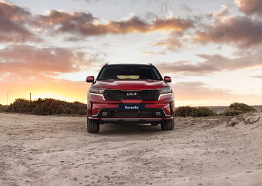 Red Kia Sorento at Sunset