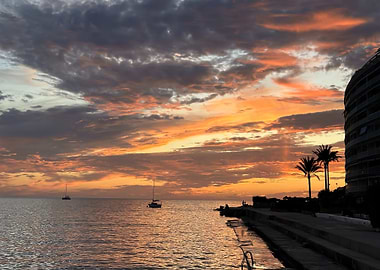 Sunset over the sea with boats
