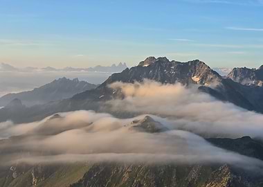 Mountain peaks shrouded in morning mist