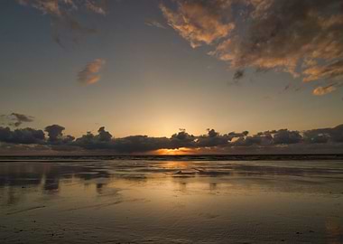 Sunset Reflection on Wet Beach Sand