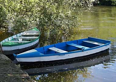 Two wooden boats on calm water
