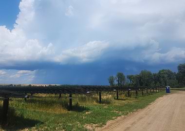 Stormy Sky over Rural Landscape