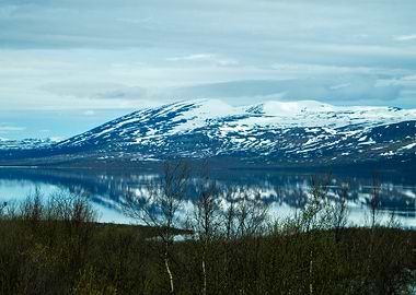Snowy Mountains Reflecting in Calm Lake