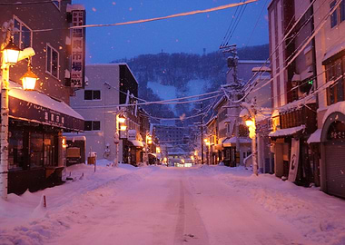 Snowy street at dusk in Japan