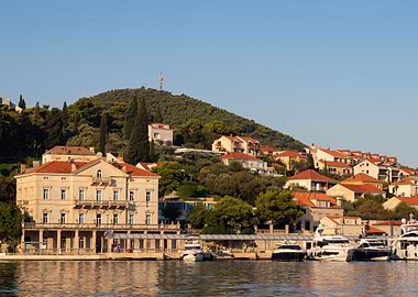 Coastal Town with Yachts and Hillside