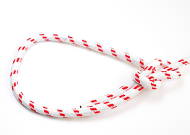 White rope with red pattern knBowline Knot on white background one of the most used loop knots