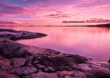 Pink Sunset Over Rocky Shoreline