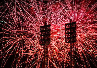 Red Fireworks Display with Stadium Lights