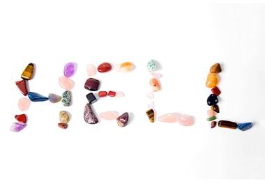 HELL spelled with colorful gem stones