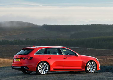 Red Audi RS4 Avant on Hillside
