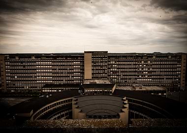 Abandoned Building Complex Under Cloudy Sky
