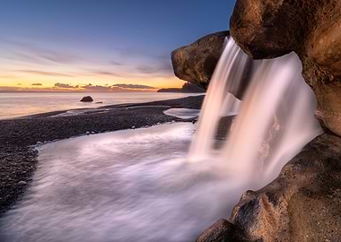 Waterfall Through Rocks at Sunset Beach