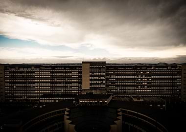 Large Brutalist Building Under Cloudy Sky