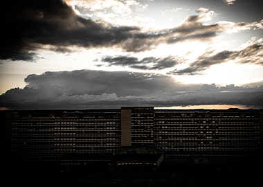 Building under dramatic cloudy sky