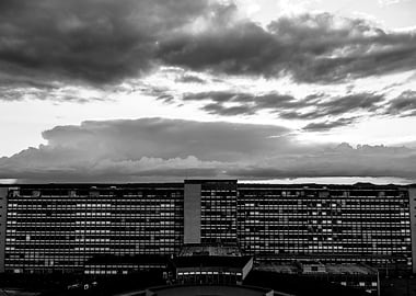 Black and White Building Under Cloudy Sky