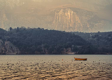 Lake with Boat and Mountain Backdrop