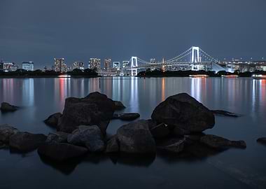 Tokyo cityscape at night with rainbowbridge