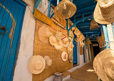 Traditional straw hats and crafts in a North African souk