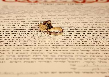 Wedding Rings on Hebrew Text Document