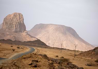 Desert Road with Mountains and Powerlines