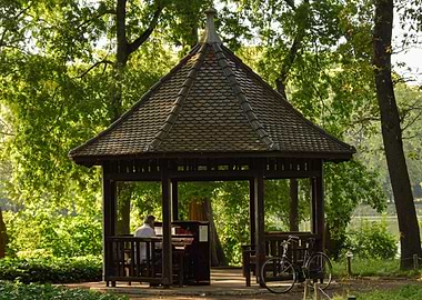 Gazebo with Piano and Bicycle in Park