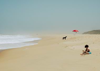 Child, Dog, and Umbrella on Beach
