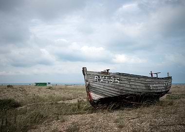 Weathered Boat on a Pebble Beach