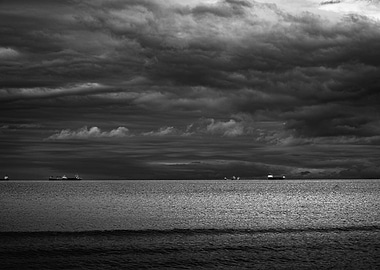 Monochrome Seascape with Ships Under Stormy Sky