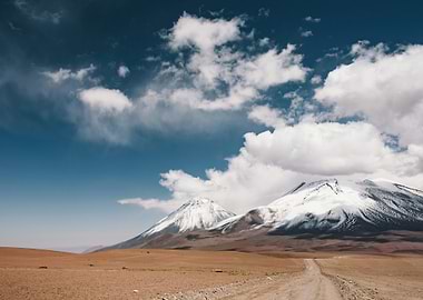 Snow-Capped Mountains Under Cloudy Sky