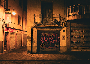 Night street with graffiti and shops