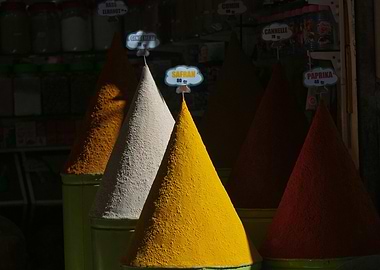Colorful Spice Cones in Market Stall