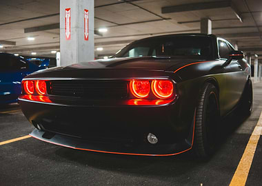 Black Dodge Challenger with Red Headlights