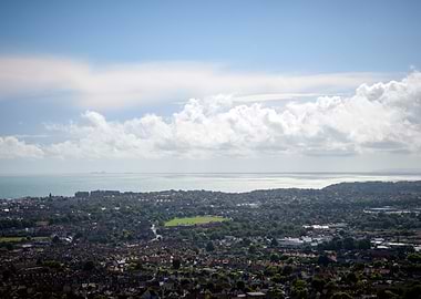 Coastal Cityscape Under Cloudy Sky
