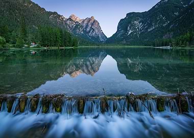 Mountain Lake Reflection with Waterfall