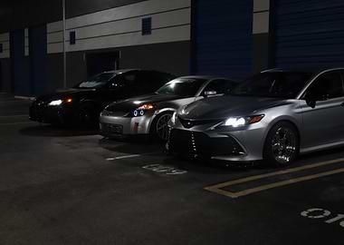 Three Cars Parked at Night